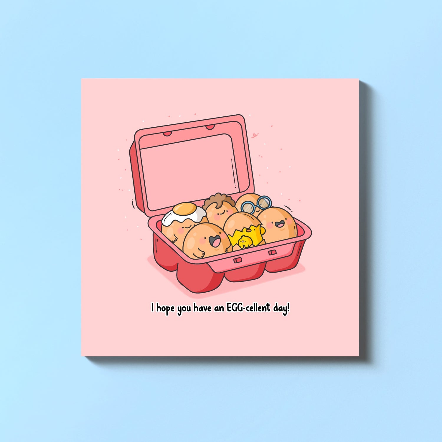 Carton of eggs greeting card on blue table