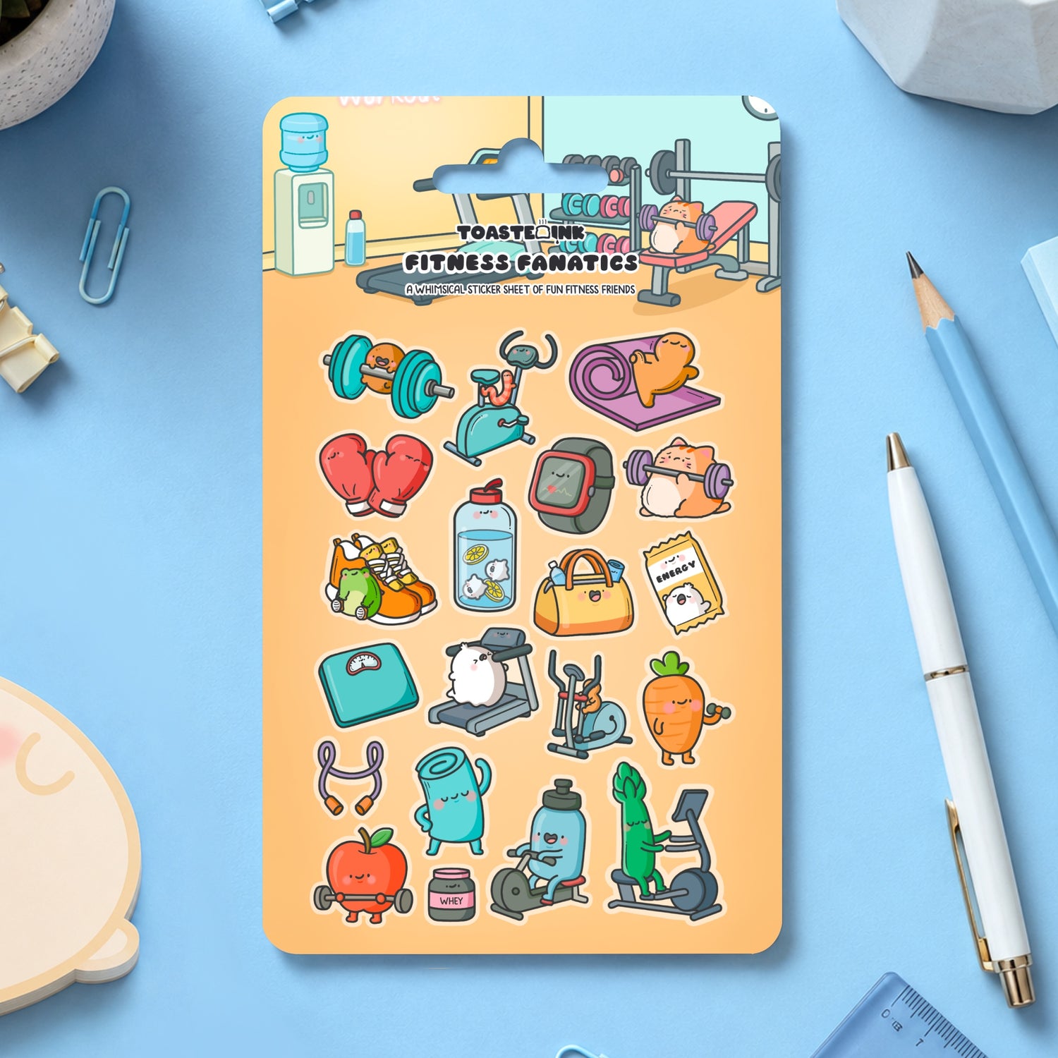 Fitness sticker sheet on blue table with modern stationery scattered