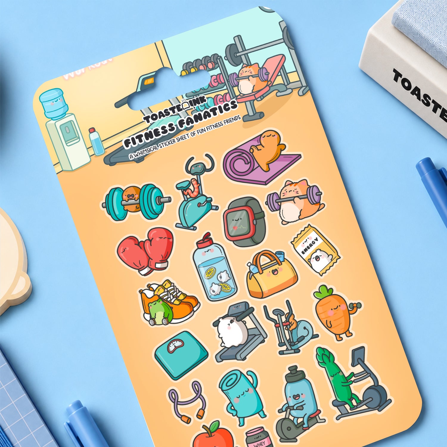 Fitness sticker sheet laid on blue desk with stationery around