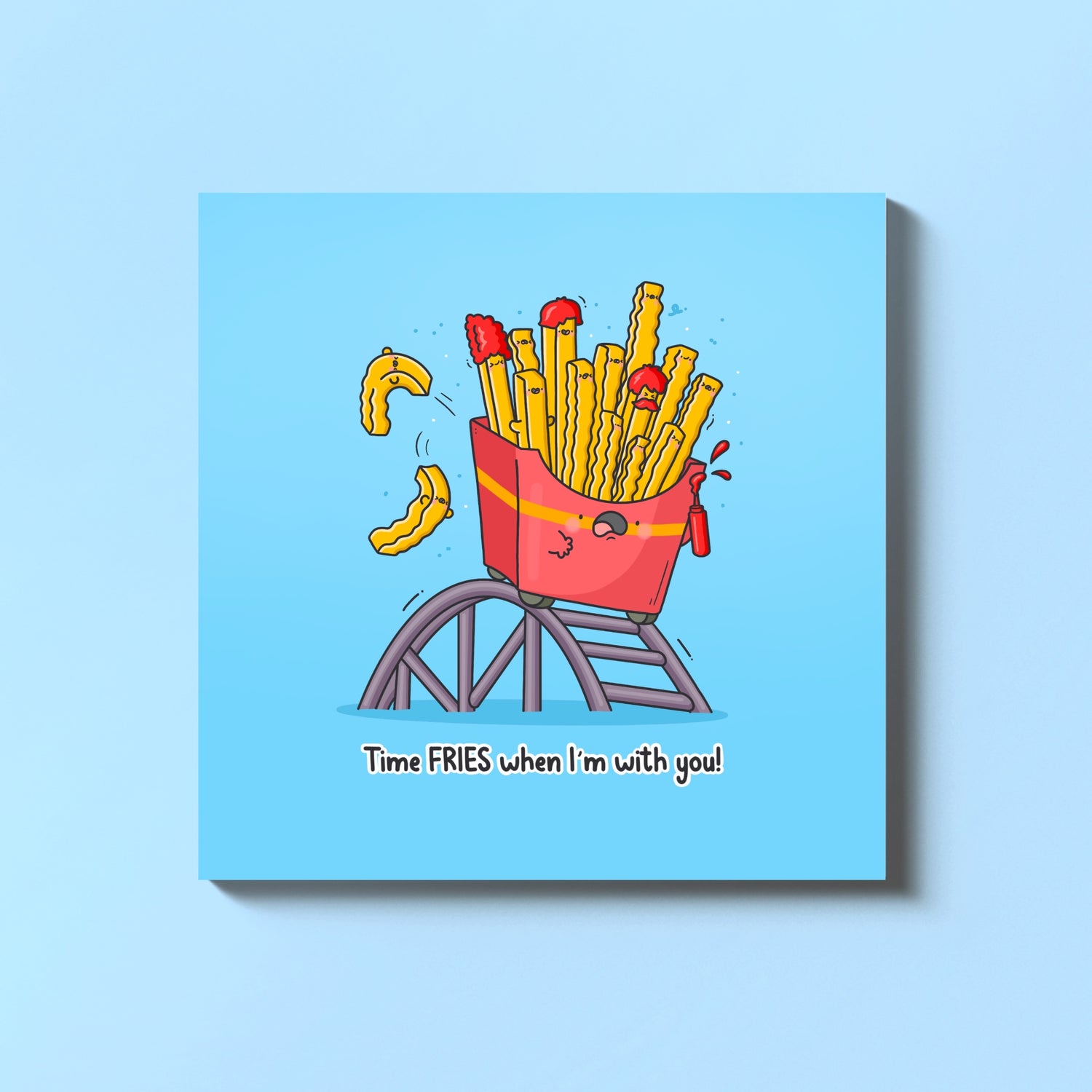 French fries on a rollercoaster card on blue table