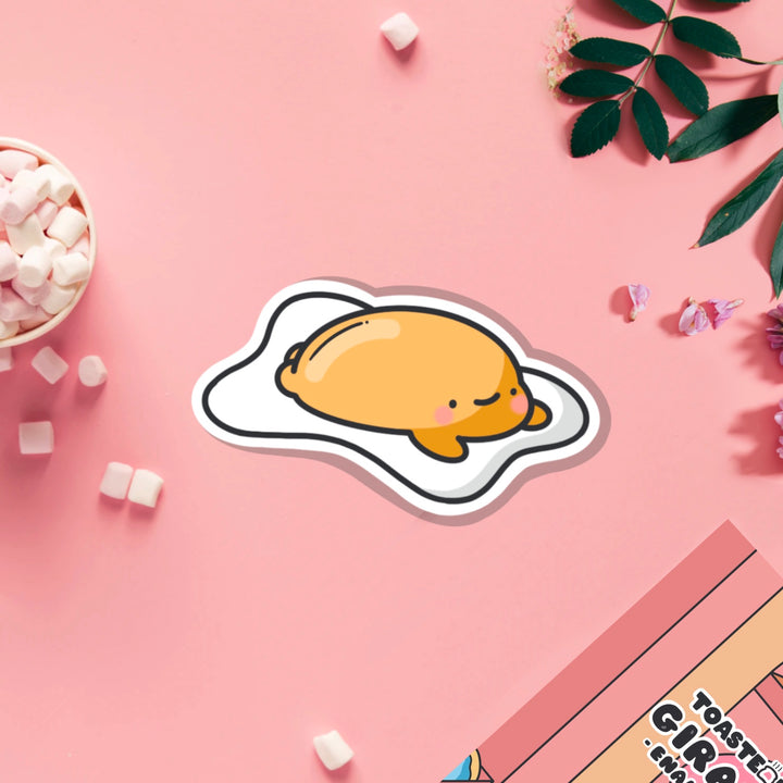 Fried egg vinyl sticker on pink table