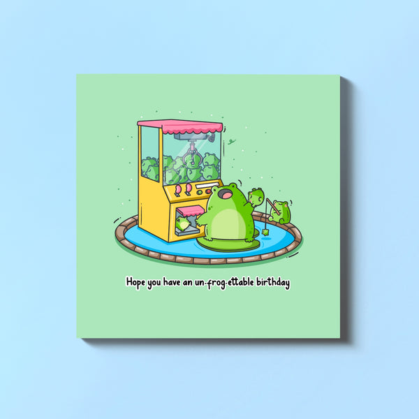 Frog birthday card on blue table