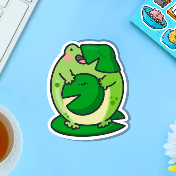 Frog on a lily vinyl sticker on blue table