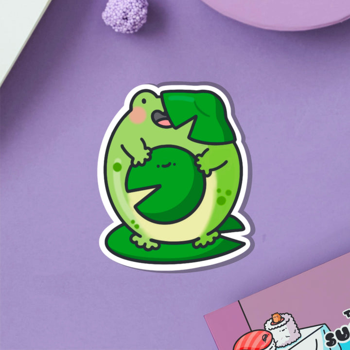 Frog on a lily vinyl sticker on purple table