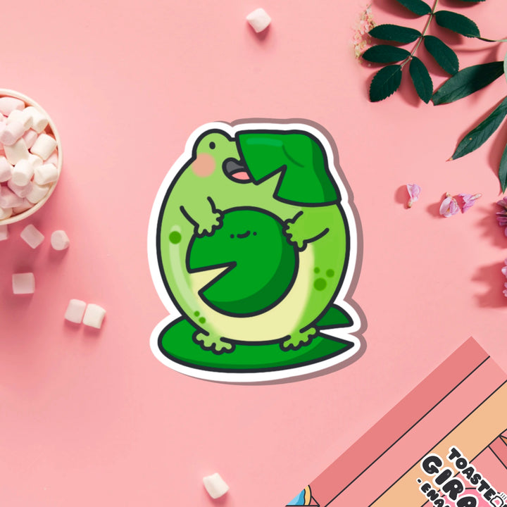 Frog on a lily vinyl sticker on pink table