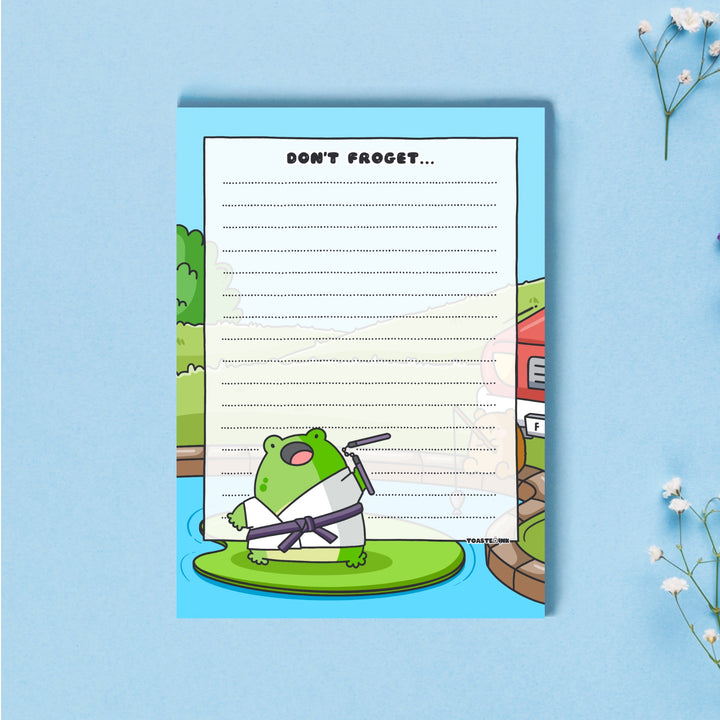 A6 frog notepad on blue desk