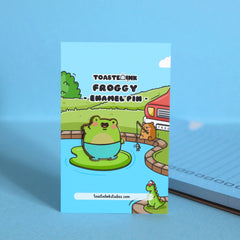Frog enamel pin on waterlily backing card
