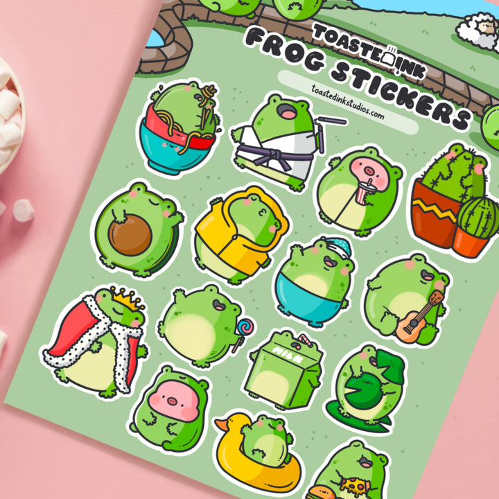 Frog sticker sheet close up on pink table