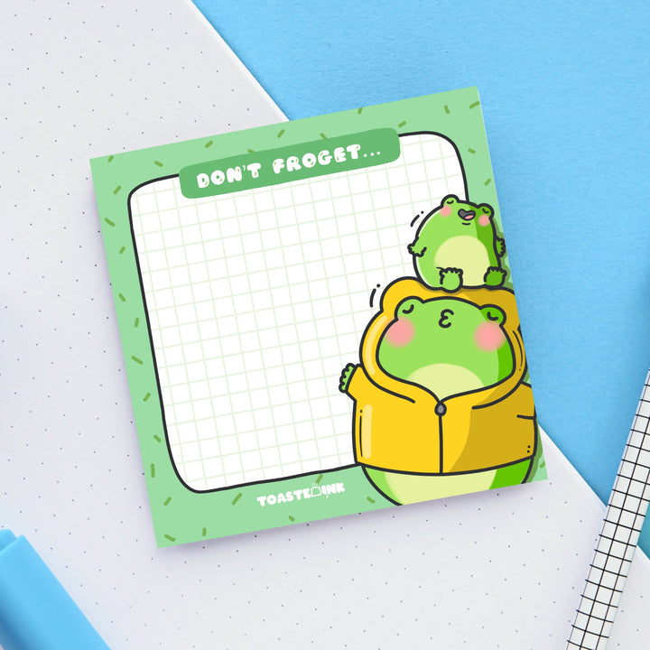 Frog Sticky Notes on blue and white desk