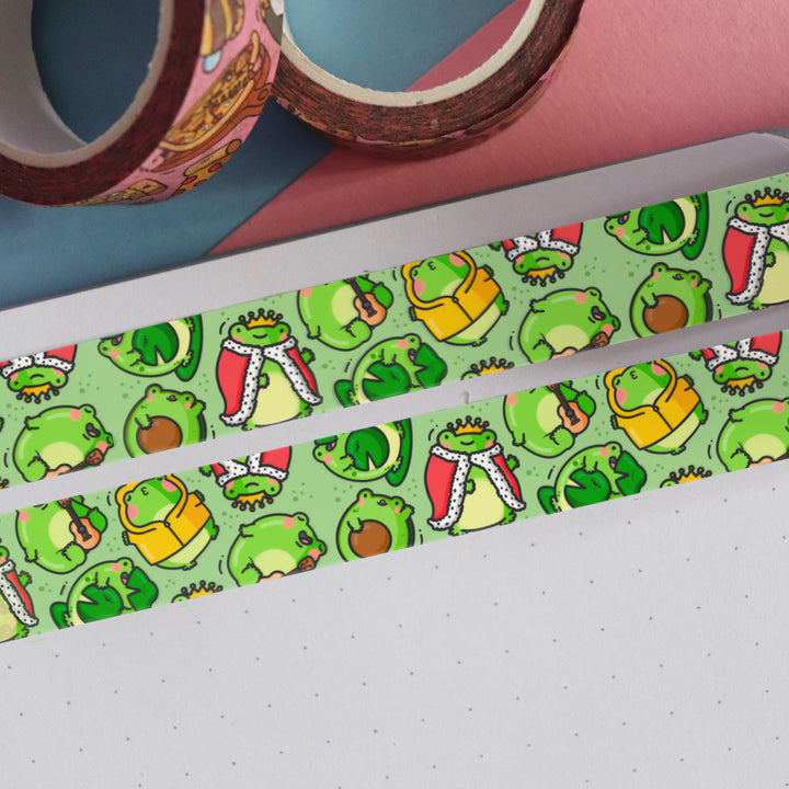 Green frog washi tape on pink and blue table with 2 rolls of washi tape