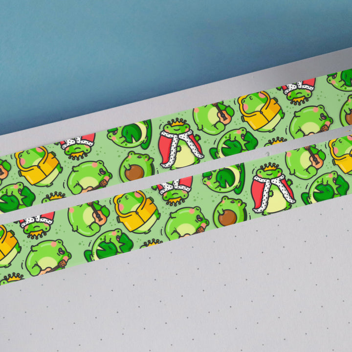 Green frog washi tape on white notebook and blue table