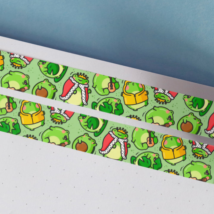 Green frog washi tape on notebook and blue table