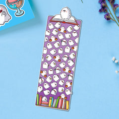 Ghost bookmark on blue table with stickers