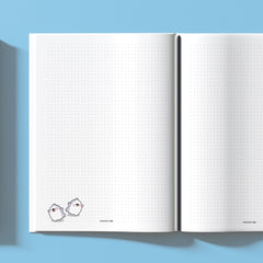 Dot grid notebook with ghosts in the corner