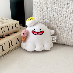 Ghost plush keychain with beige cushion and books