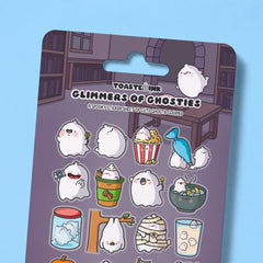 Close up of whimsical ghost sticker sheet on blue desk