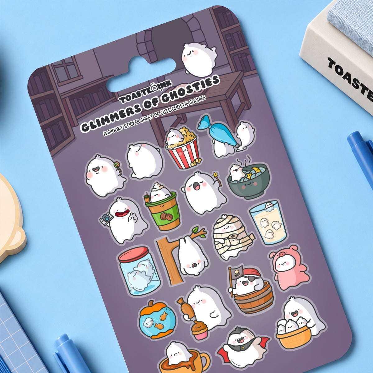 Ghost sticker sheet placed on blue desk with stationery