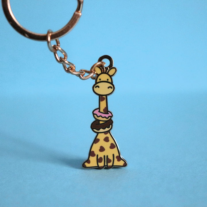 Giraffe with donuts keychain with blue background