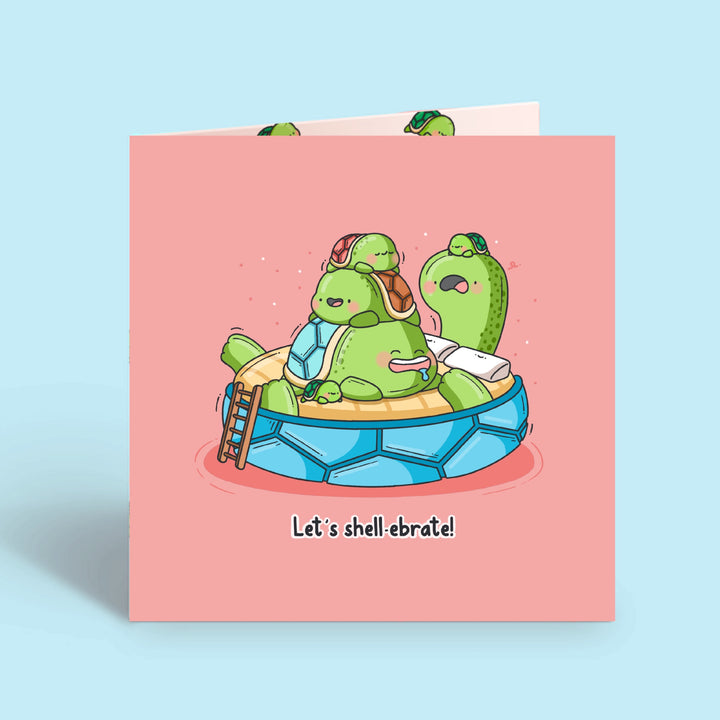 Turtle birthday card on blue desk