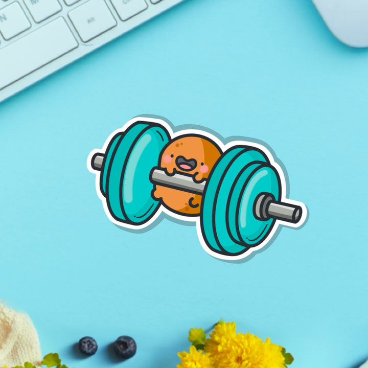 Gym potato vinyl sticker on table with keyboard