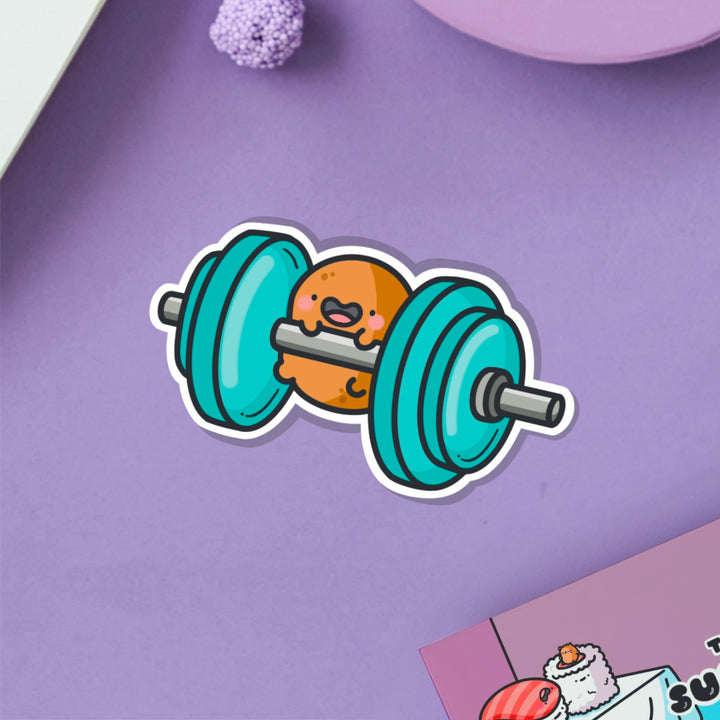 Gym potato vinyl sticker on purple table