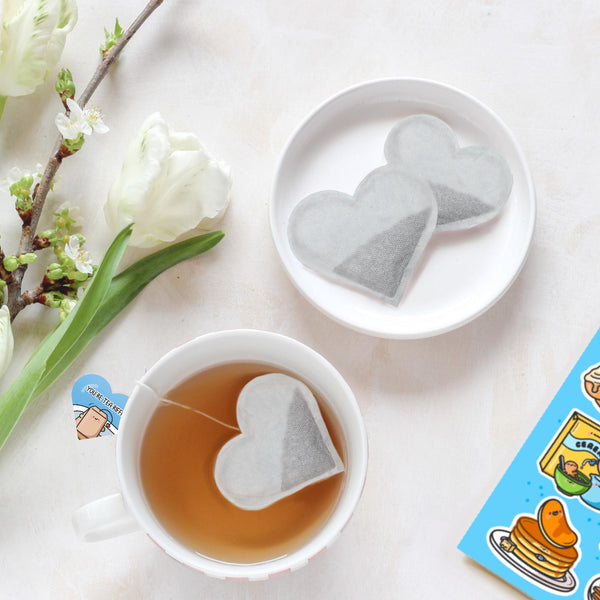 Heart shaped tea bags in mug