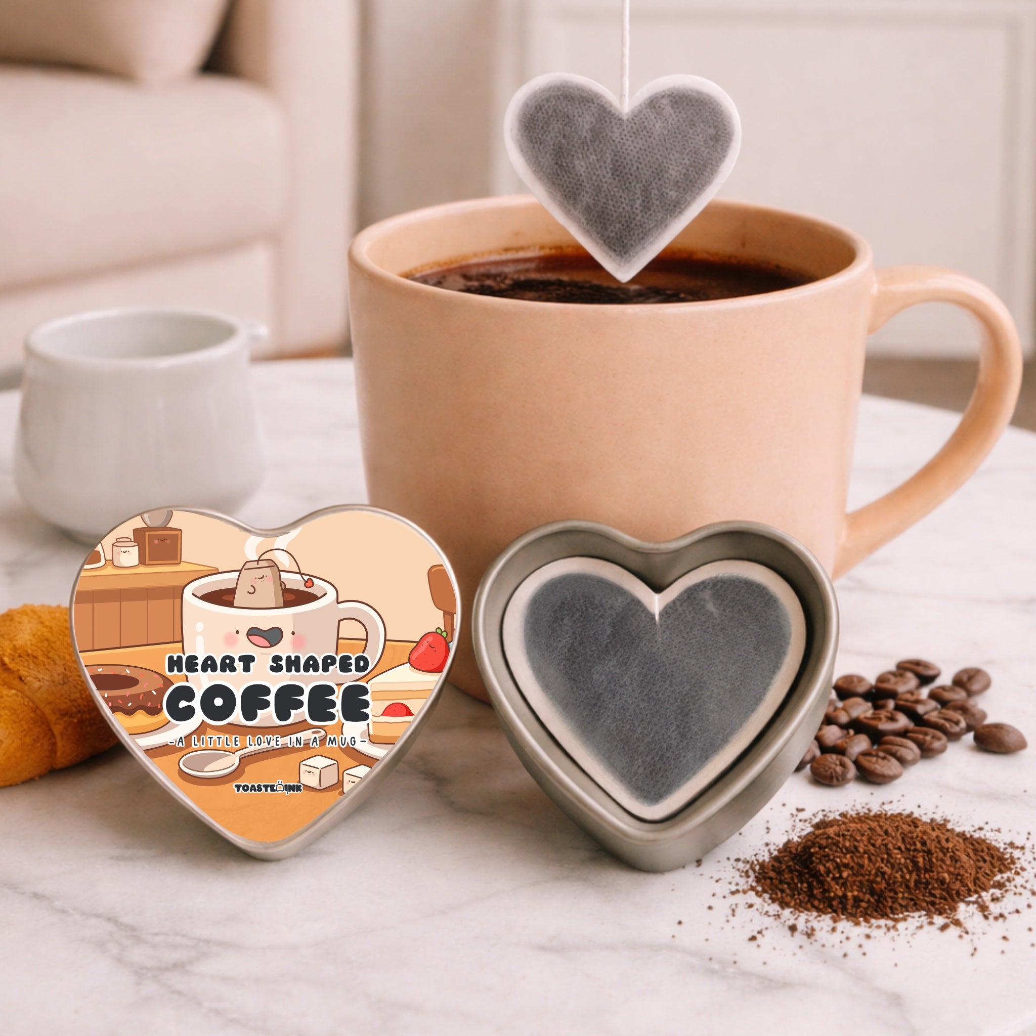 Heart-shaped coffee filter with a cup of coffee and beans on a marble surface