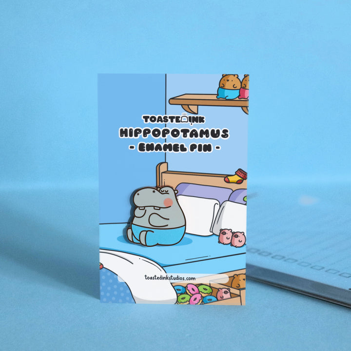 Hippo enamel pin on bedroom backing card