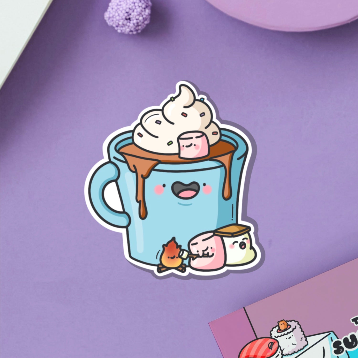 Hot chocolate with marshmallows vinyl sticker on purple table