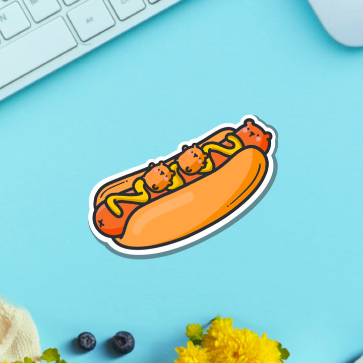 Hot Dog Bear Vinyl sticker on blue table with keyboard