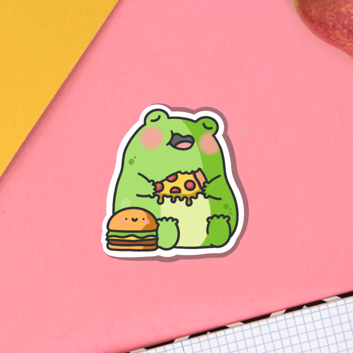 Frog eating pizza vinyl sticker on pink table