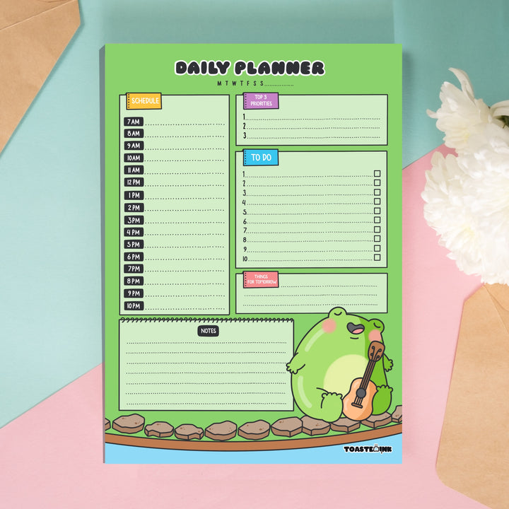 Frog A5 planner on green and pink background