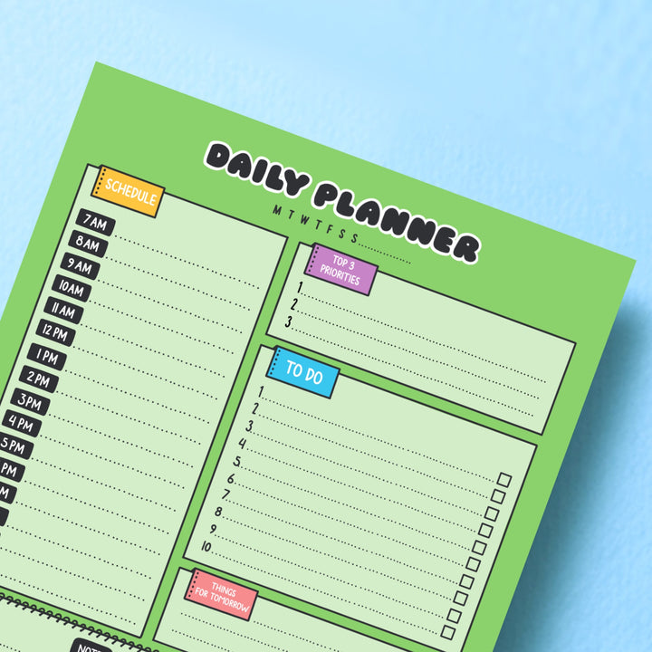 Frog daily planner on blue table