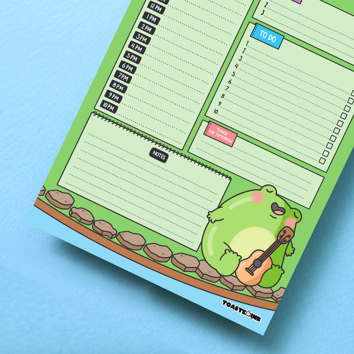 Frog daily planner on blue background