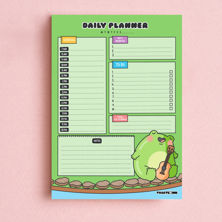 Frog A5 daily planner on pink background