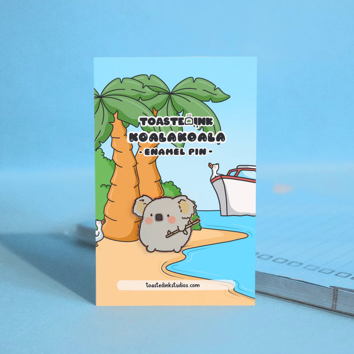 koala on a beach backing card enamel pin