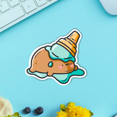 Potato in ice cream vinyl sticker on blue table with keyboard