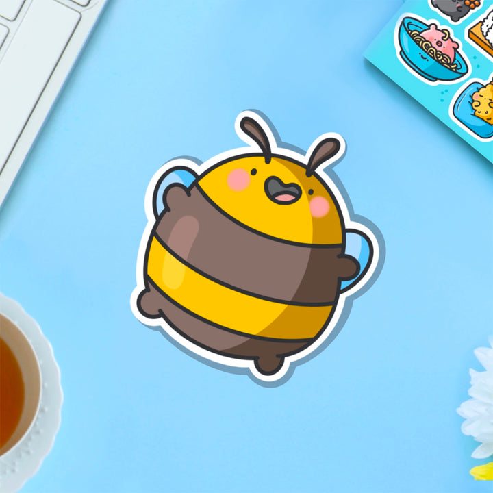 Jumping bee vinyl sticker on blue table