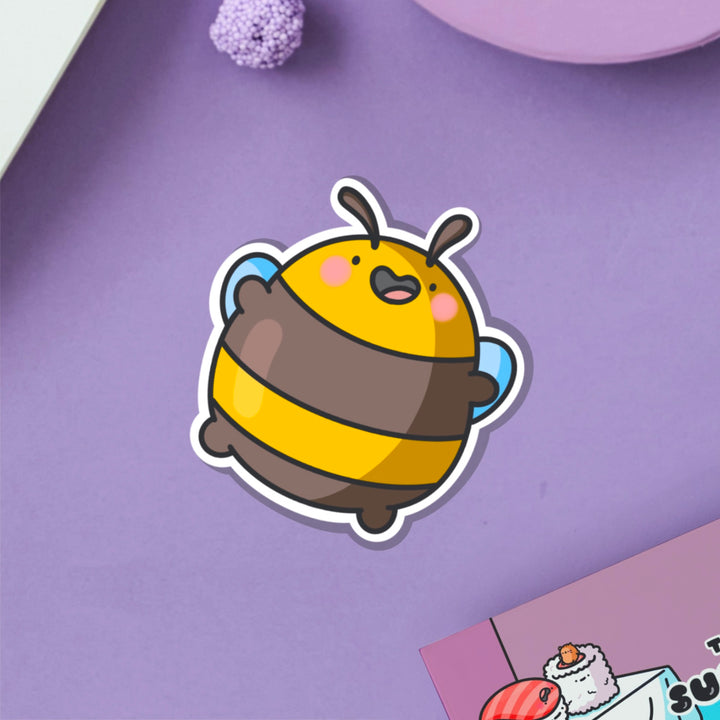 Jumping bee vinyl sticker on purple table