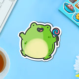 Jumping frog vinyl sticker on blue table