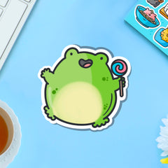 Jumping frog vinyl sticker on blue table