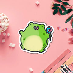 Jumping frog vinyl sticker on pink table