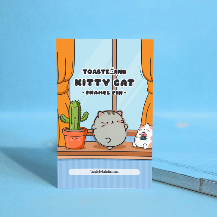 Grey Kitty Cat Enamel Pin on window backing card