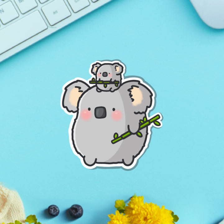 koala vinyl sticker on blue table with keyboard