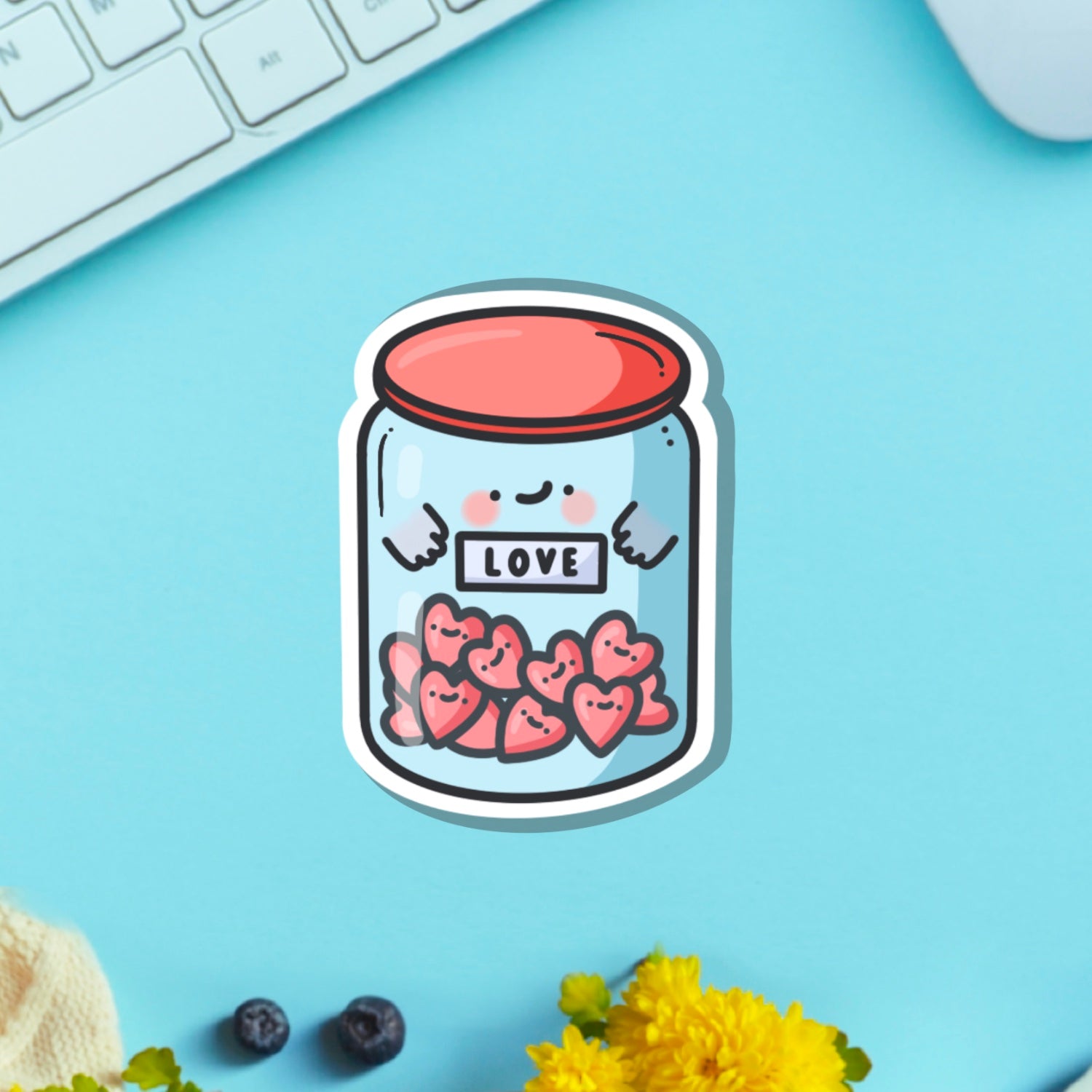 Love jar vinyl sticker on green table