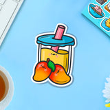 Mango bubble tea vinyl sticker on blue table