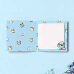 Marshmallow design inside card on blue table