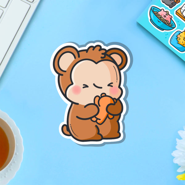 Monkey hugging teddy bear vinyl sticker on blue table