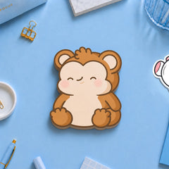 monkey shaped sticky notes on blue table with stationery