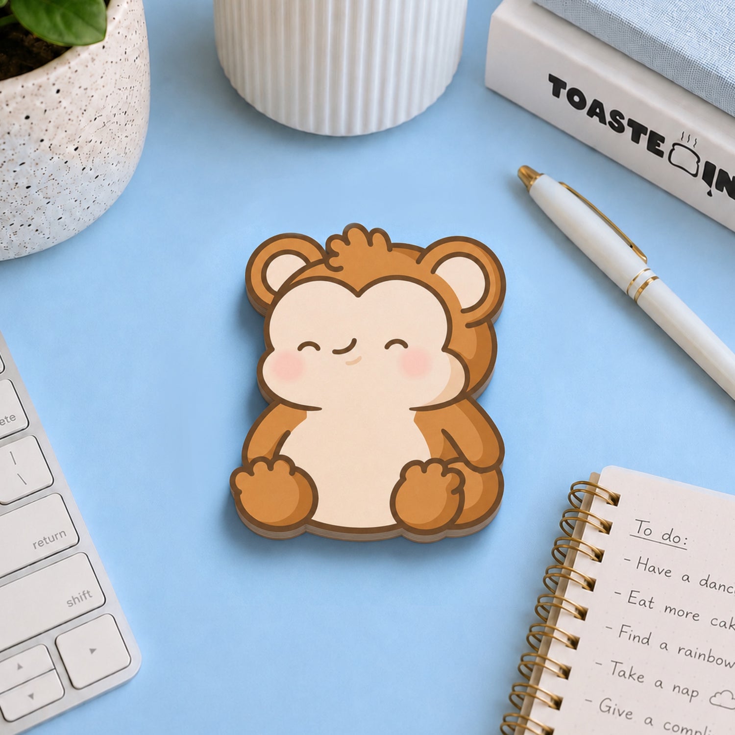 monkey shaped sticky notes on blue desk with stationery